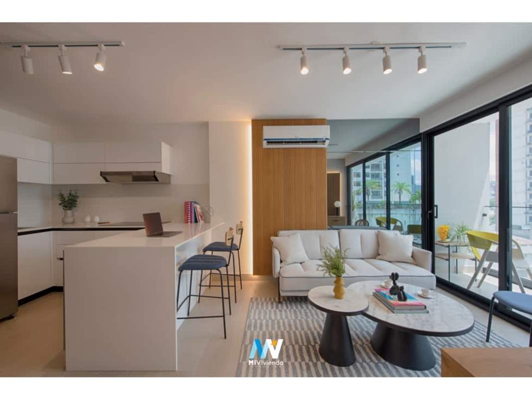 Open concept kitchen living with island, large windows PH Be Living Panama City