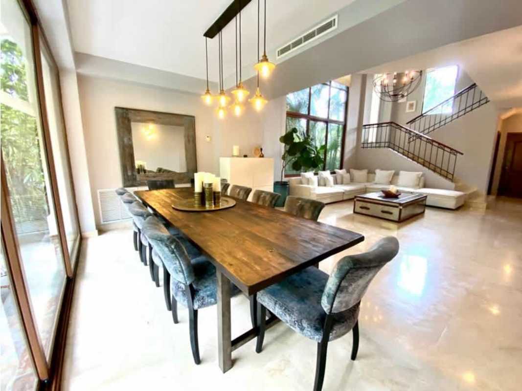 Modern kitchen with granite island and panoramic windows in luxury home Clayton