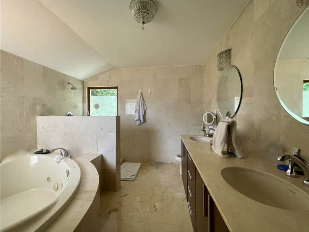 Luxury bathroom with jacuzzi tub, walk-in shower and double vanity in home Senderos de Camino de Cruces Clayton