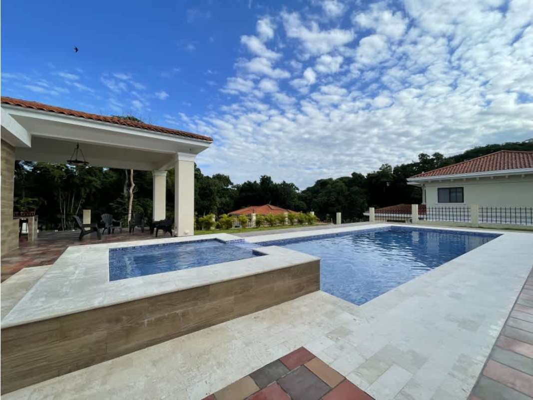 Double height foyer with chandelier and elegant staircase PH Los Senderos Clayton Panama