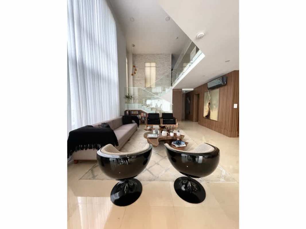 Elegant entrance with wood paneling and marble staircase in PH Los Senderos Clayton Panama