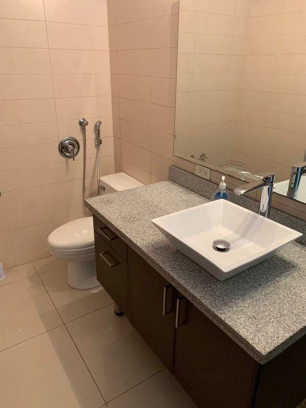 Stylish double-height living room with stairs and windows PH Vitro Loft El Cangrejo