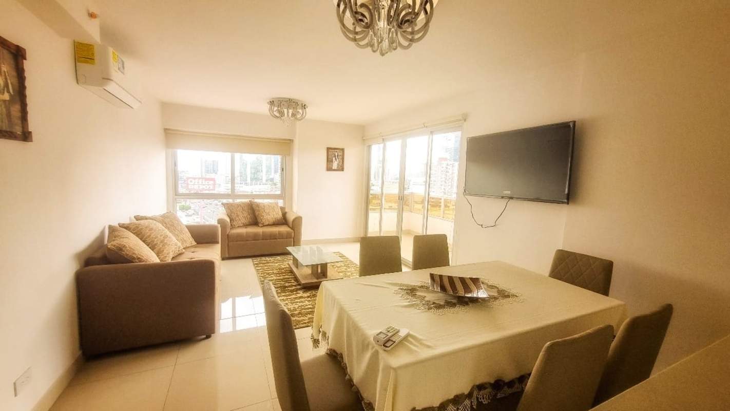 Living room with balcony access furnished 3BR apartment for rent PH Vía España Panama