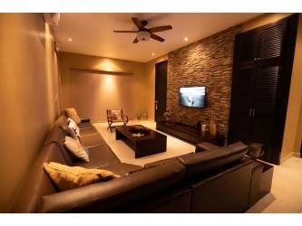 Bedroom with sofa, bed, large windows and AC in Playa Blanca Panama