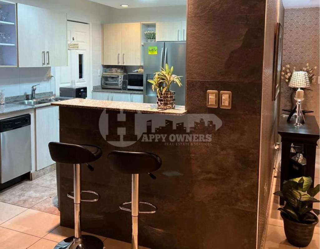 Modern kitchen with granite countertops and stainless appliances in PH Costa View Panama