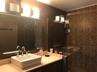 Spacious terrace with views of the mountains and gardens in River Valley condo Panama Pacifico