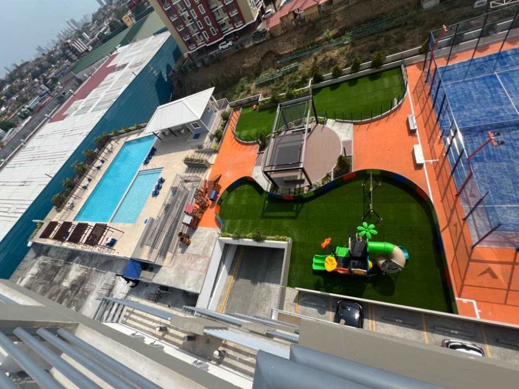 Sunlit main bedroom with tile floors and panoramic window at PH Venice Place Panama
