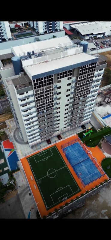 High angle shot of pools, sports courts, gardens and playground at PH Venice Place Panama City