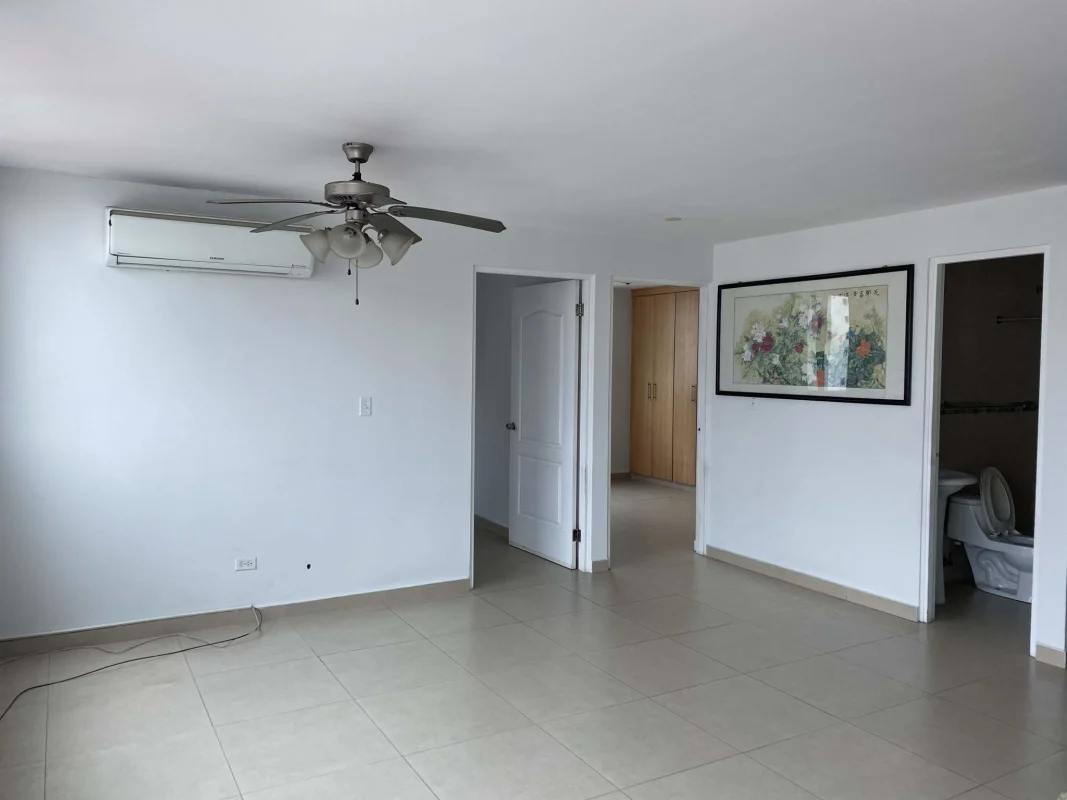 Living and dining area with balcony access, tiled floors, ceiling fan in PH Green Point San Francisco Panama