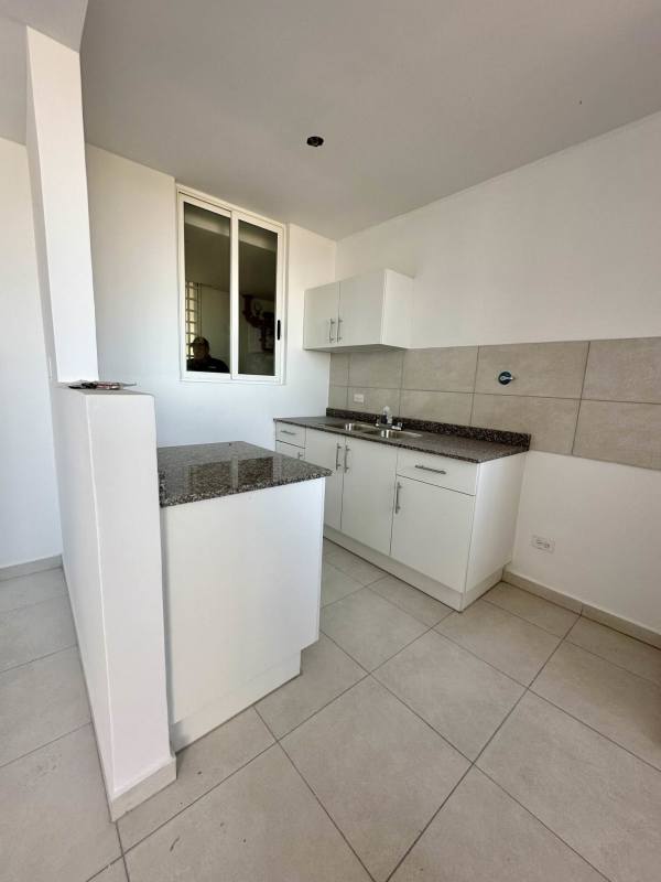 Kitchen area with granite counters white cabinetry tile floors in PH Mystic Valley El Crisol Panama