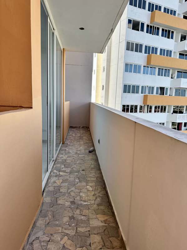 Private balcony with railing and view of El Crisol Panama Cityscape from PH Mystic Valley high-rise
