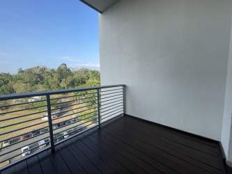 Modern bathroom with glass shower at PH Mosaic Panama Pacifico