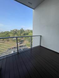Main bedroom with large window and built-in closet at PH Mosaic Panama Pacifico