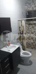 Modern bathroom with vanity, toilet, tiled shower in Guayacanes Chitré house rental