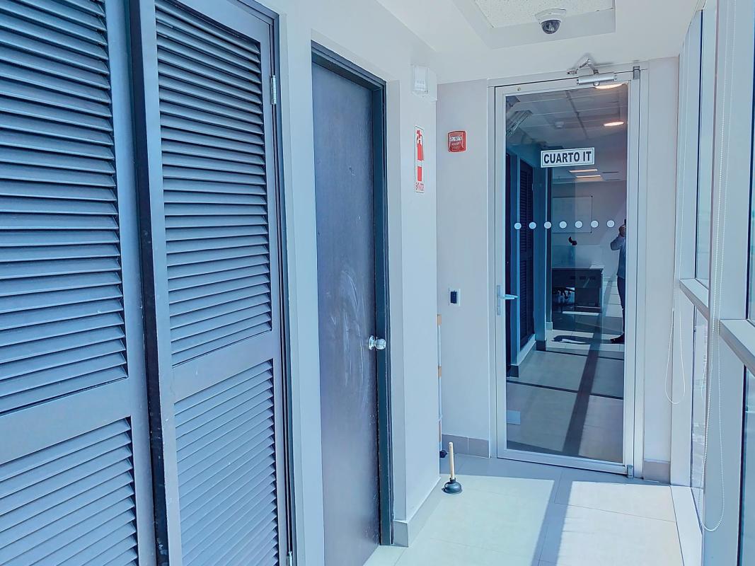 Glass door entrance to server room and hallway in Hi-Point Obarrio office building