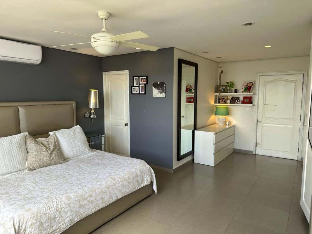 Bathroom with double vessel sinks, walk-in shower, teal accents at PH Cocomar Coco del Mar Panama