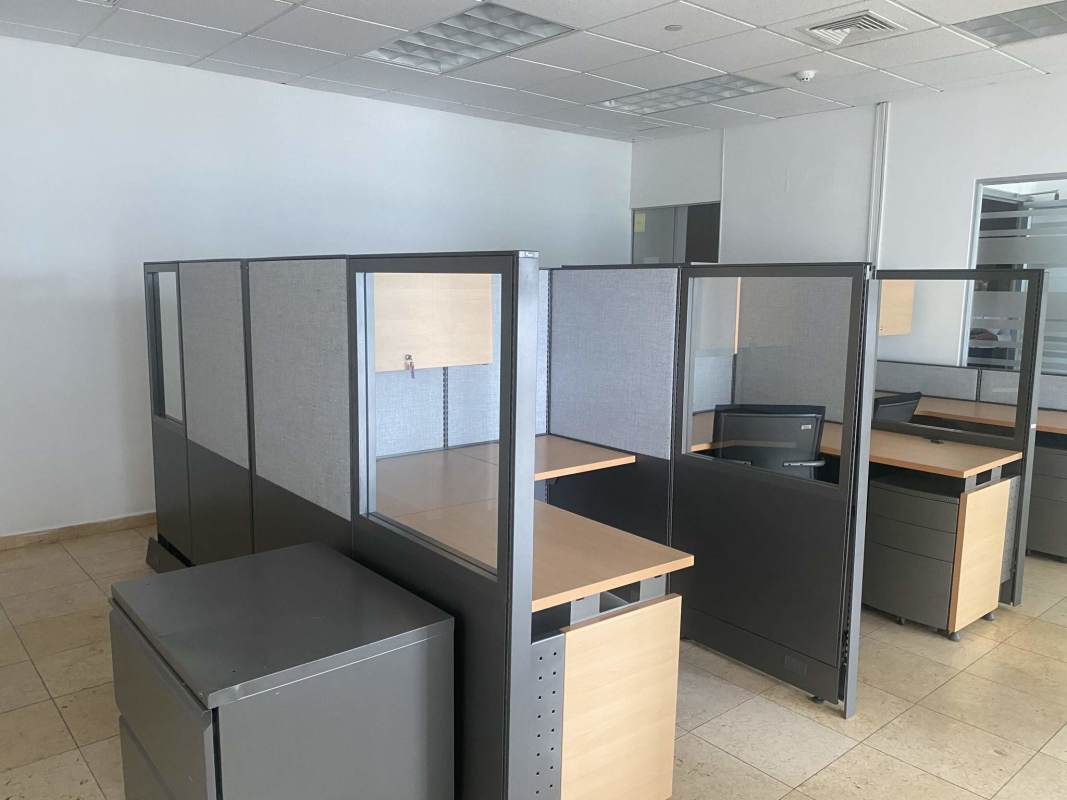 Modern workstation cubicles with glass panels in commercial office Global Bank Tower Panama City