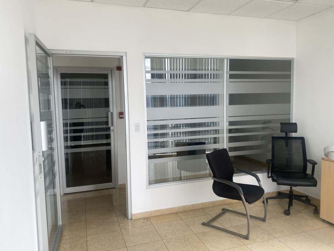 Reception with service window, drop ceiling, office cubicles view in furnished suite Torre Global Bank Panama
