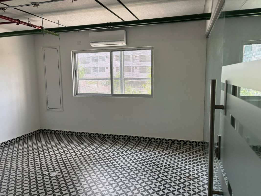 Modern office room with floor-to-ceiling windows, tile floor Dream Plaza Costa del Este Panama