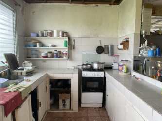 Rustic kitchen open shelves, freestanding oven, tile counter Lago Mar San Carlos