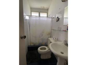 Full bathroom with shower pedestal sink toilet tile wall Lago Mar San Carlos