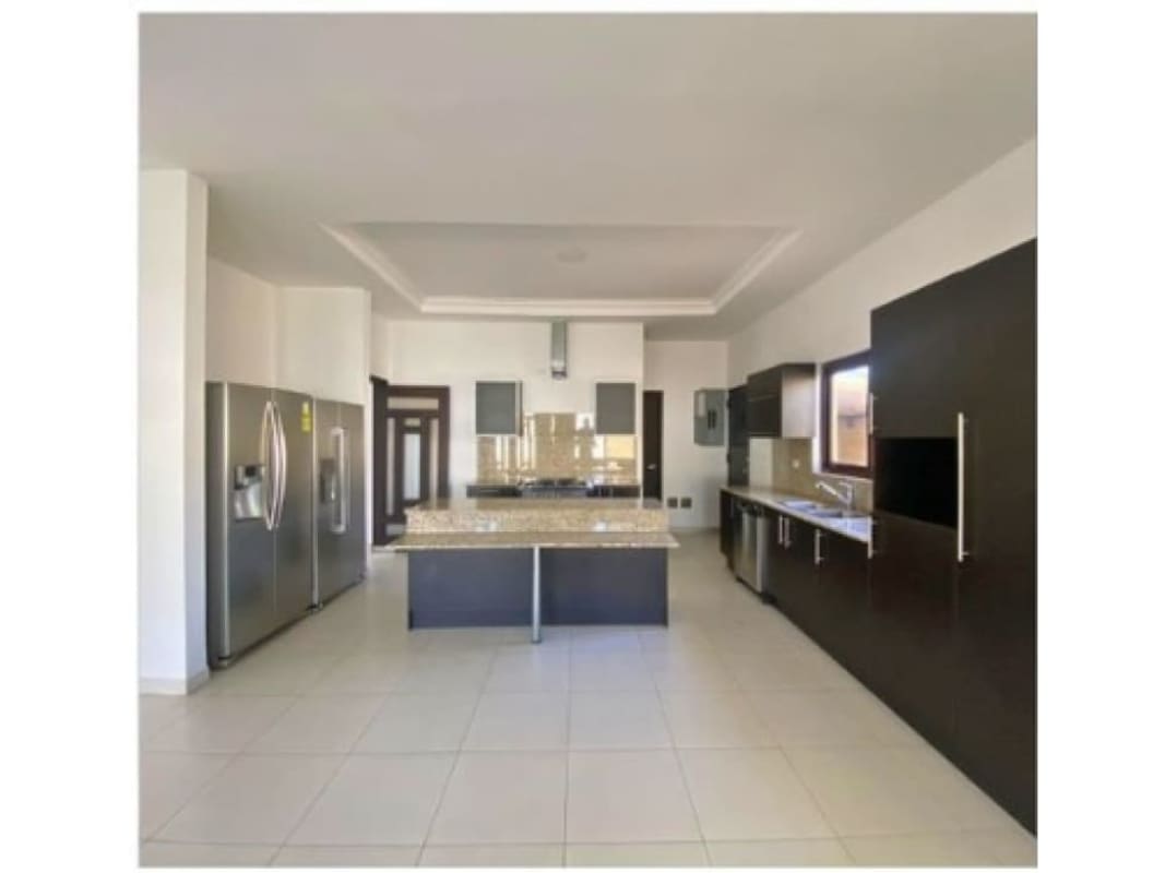 Large private backyard with landscaped garden and covered terrace in Sunset Coast Costa Sur Panama City