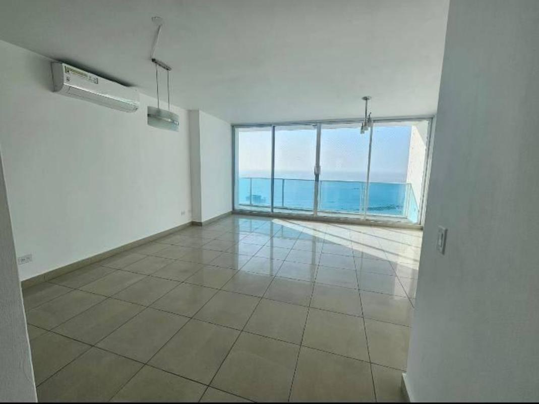 Spacious modern living room with large windows overlooking the Pacific Ocean in Coco del Mar Panama
