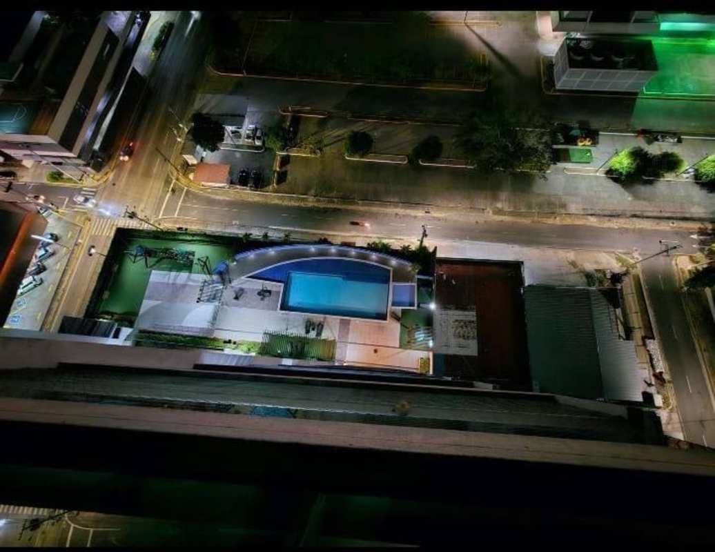 Aerial view of infinity pool and amenities at night PH Cabo Marzo Coco del Mar Panama City
