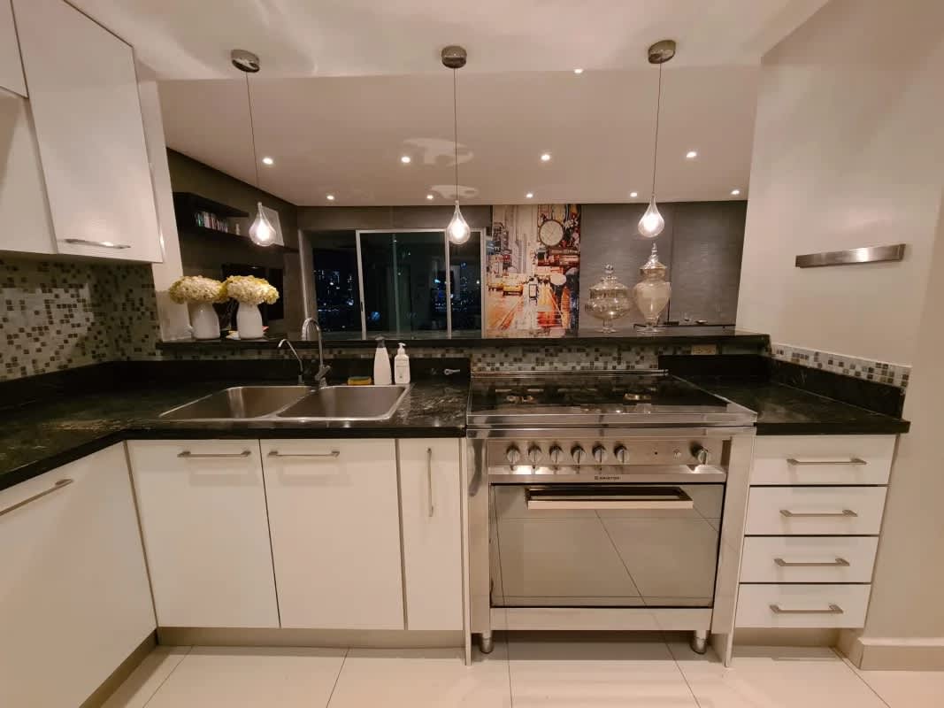 Remodeled kitchen with granite counters, mosaic backsplash, stainless appliances in PH Park View Via Porras Panama
