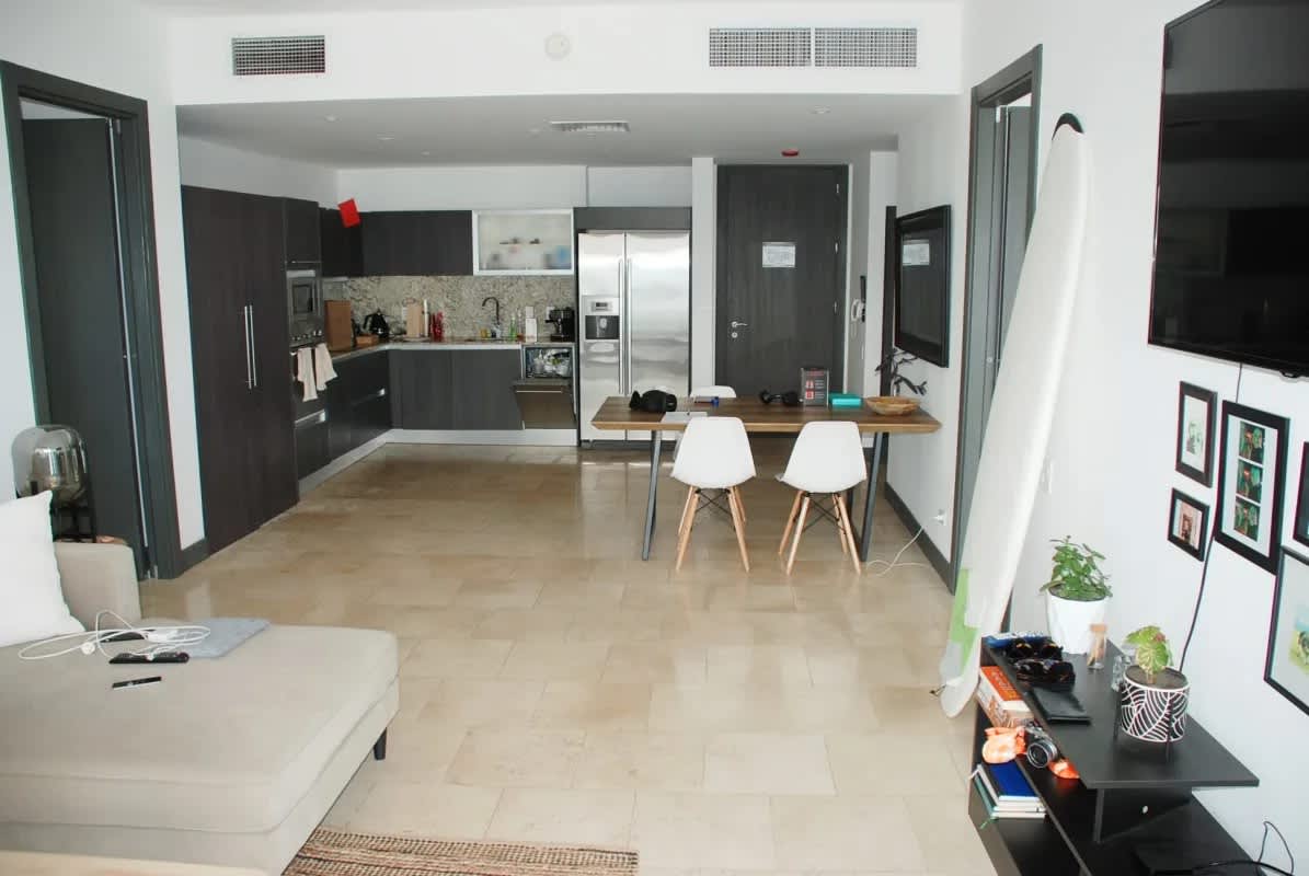 Living area with ocean views, neutral decor, and floor-to-ceiling windows in PH Trump Ocean Club Panama City