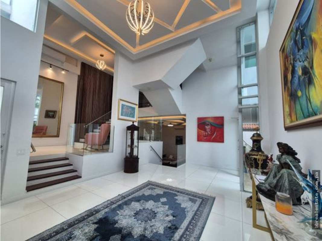Grand entry foyer marble floors chandelier minimalist house Altos del Golf Panama City
