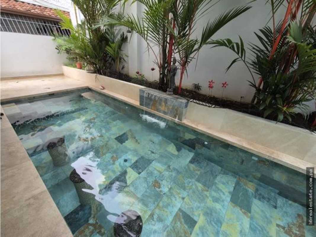 Small turquoise plunge pool tropical landscaping water feature minimal house Panama