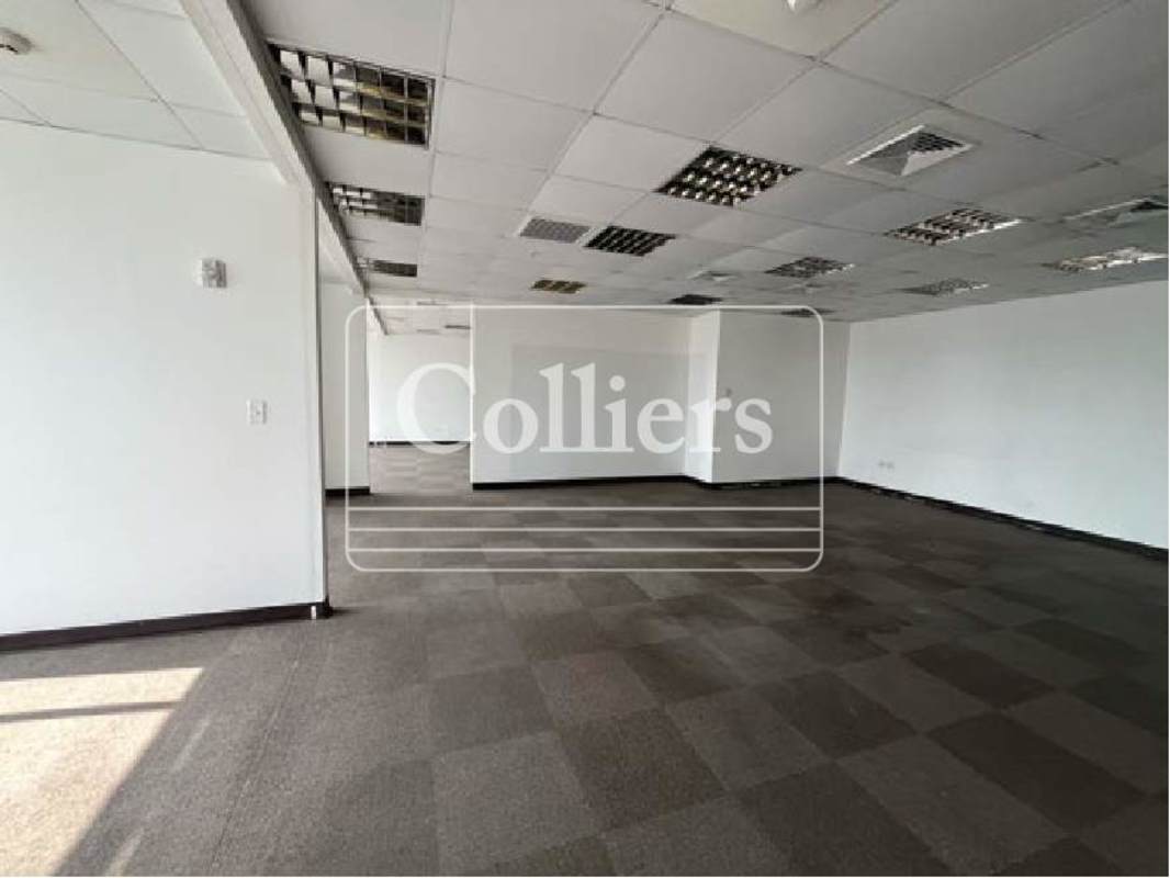 Spacious empty commercial office floor with carpet and drop ceiling in PH BICSA Tower