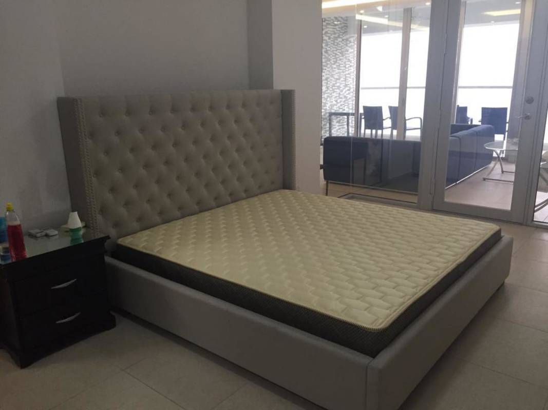 Open dining area with glass table and modern decor in oceanview apartment PH Rivage Panama