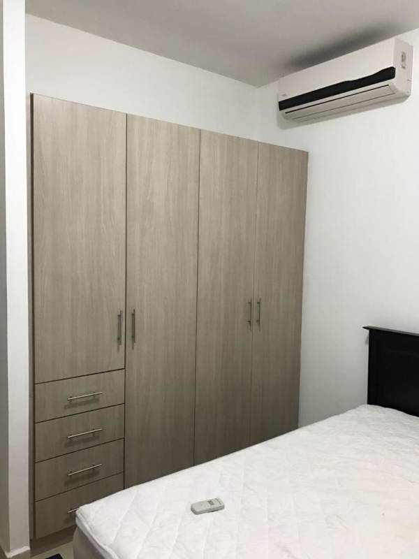 Modern bedroom with built-in closet and city views in PH Rivage Avenida Balboa Panama City