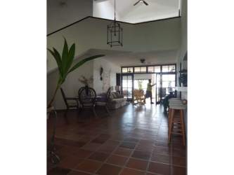 Double height ceiling living room with terracotta tiles and ocean view in beachfront Rio Hato Panama villa