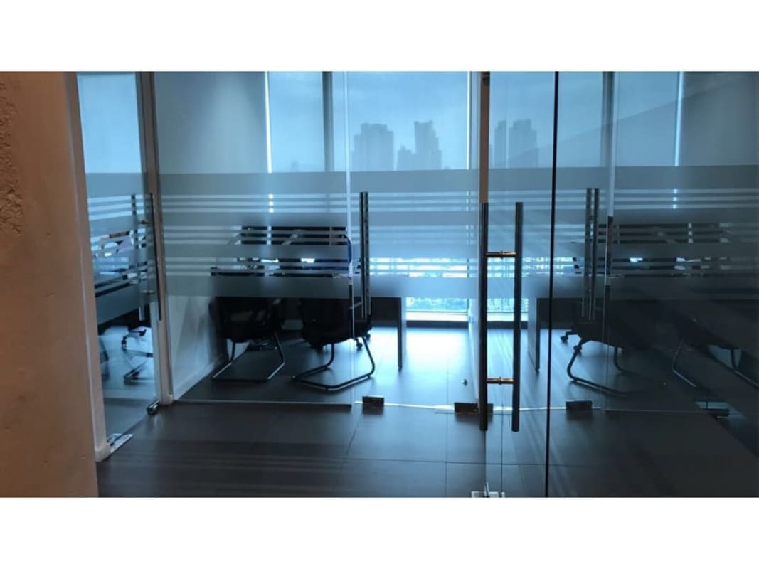 Modern waiting area with wall art and seating in Oceania Business Plaza Panama City