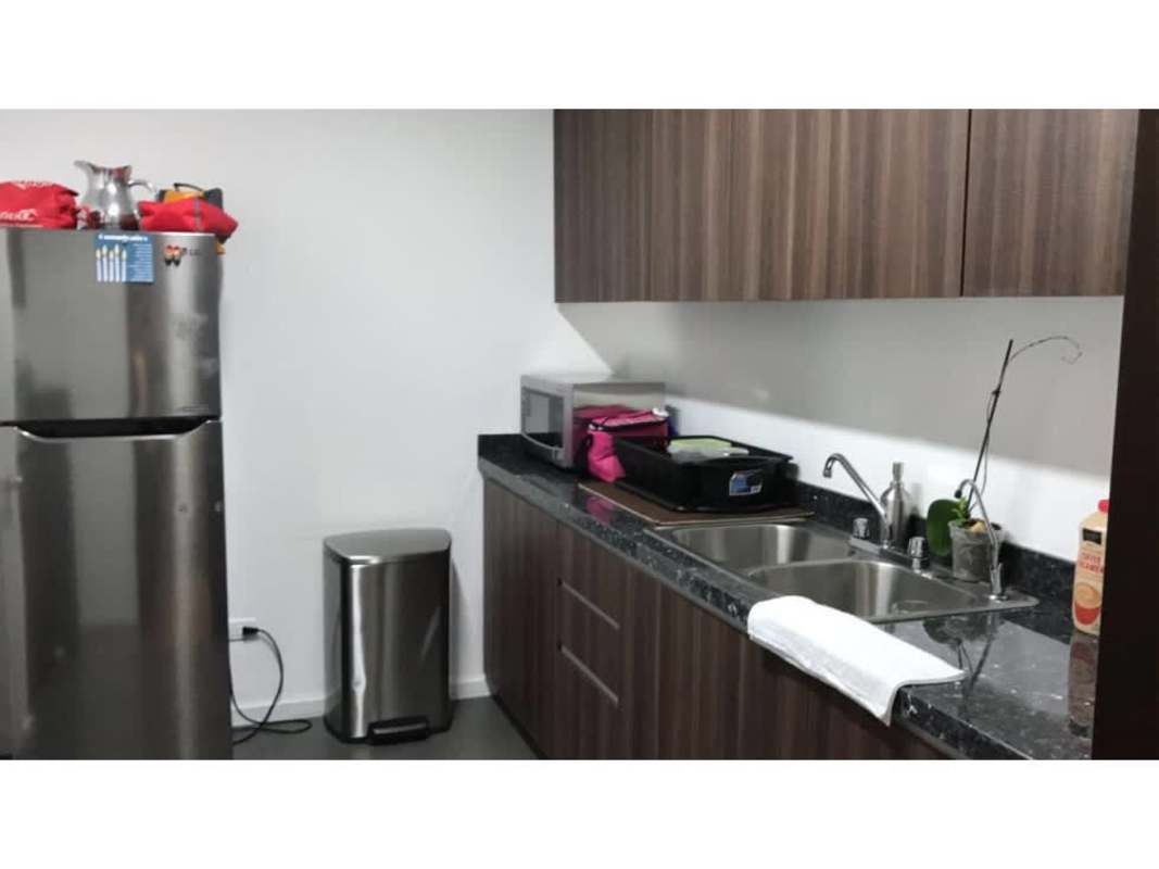 Pantry kitchen area with fridge and microwave in Oceania Business Plaza office Panama City