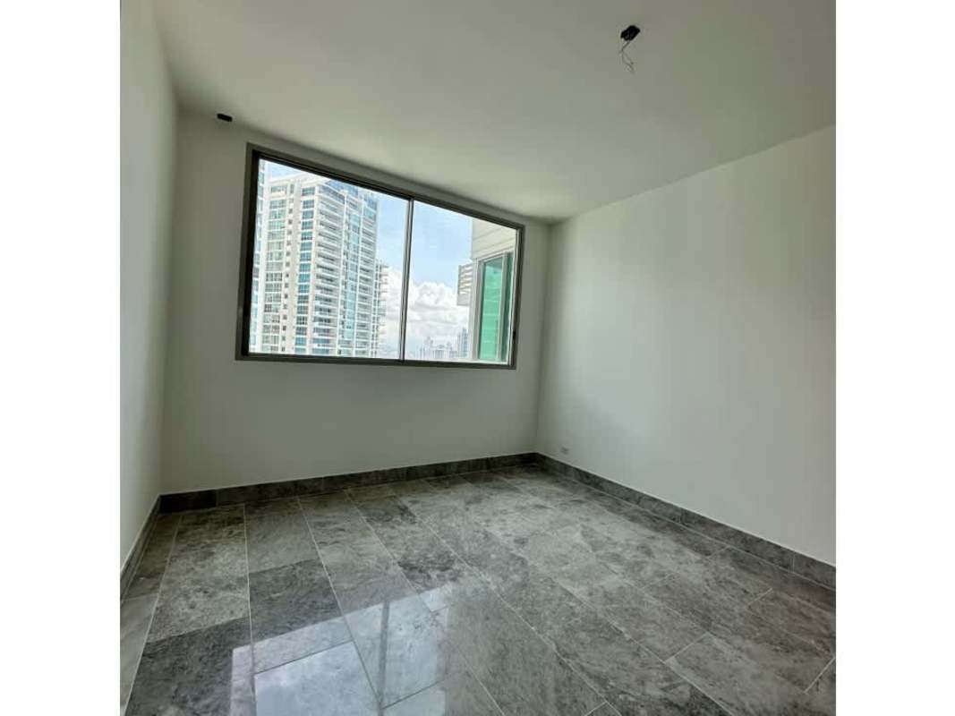 Bright master bedroom with marble floors, ocean panoramic view through large windows at Pacific Point Punta Pacifica