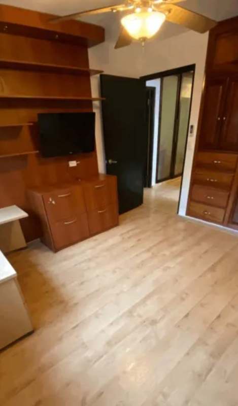 Modern kitchen with brown cabinets, dual sink, pendant lights, open pass-through window PH Girasol Marbella