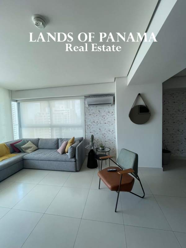 Glass balcony offering stunning views of Costa del Este skyline and Pacific Ocean at PH Parkside Panama