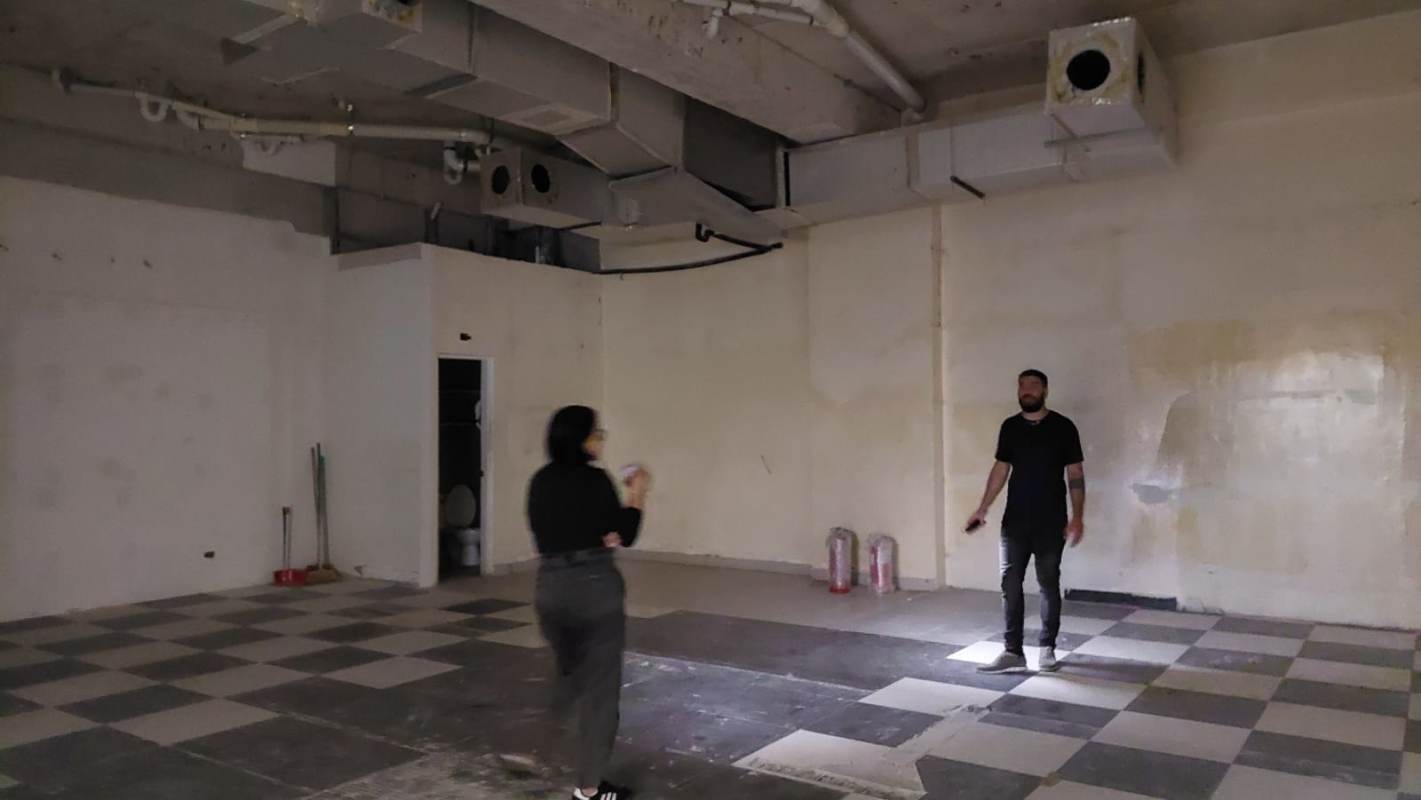 Empty commercial shell space with high ceiling exposed ductwork in Albrook Mall Panama City