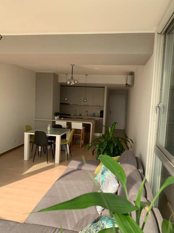 Open dining and living area with modern furnishings PH Quartier del Mar