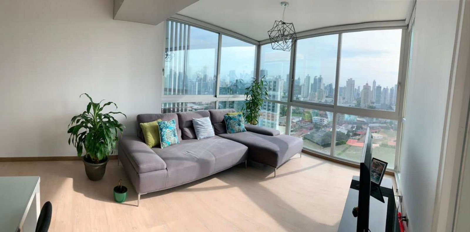 Bright living room with panoramic windows modern furnishings Coco del Mar Panama