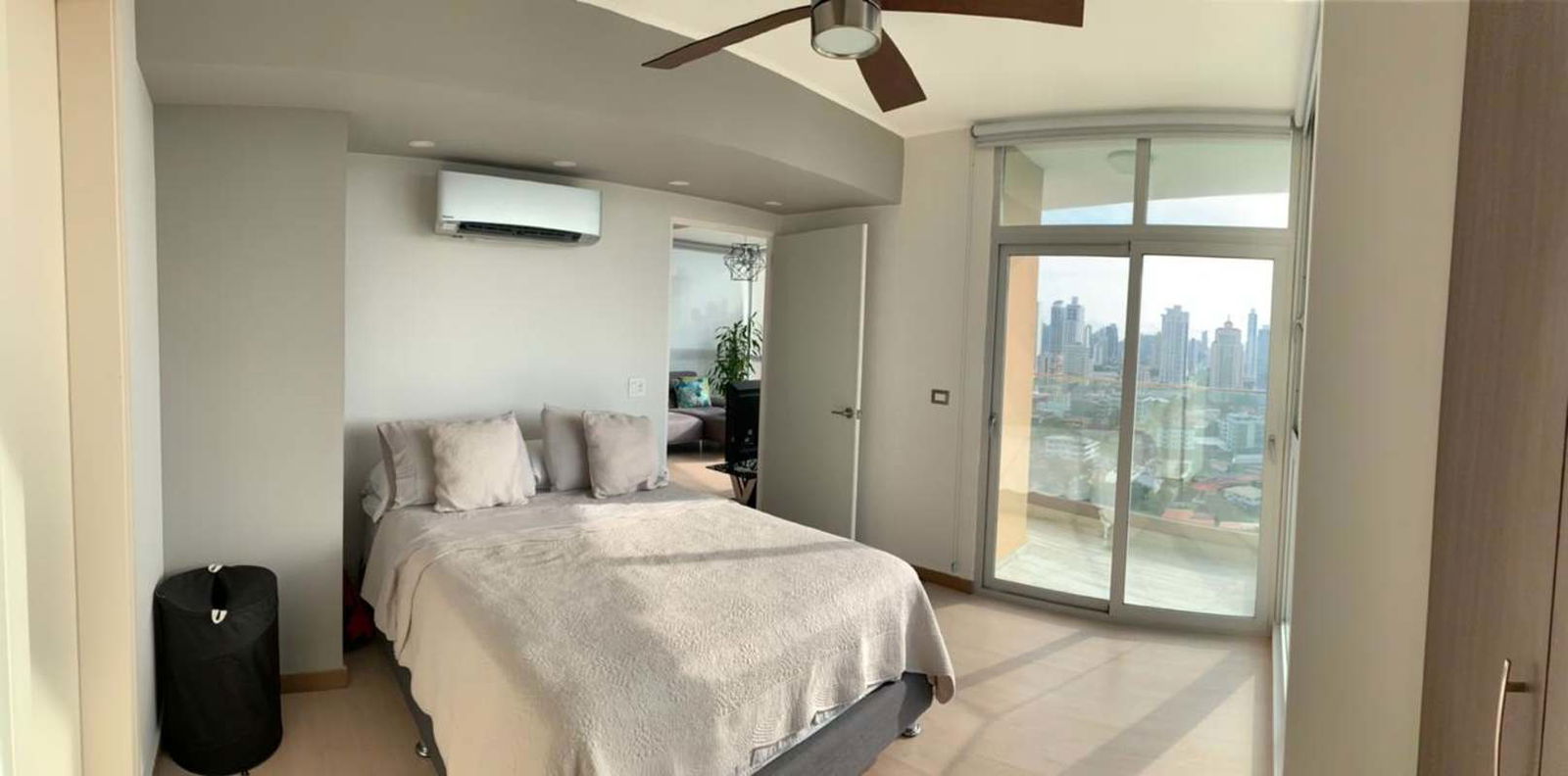 Comfortable bedroom with built-in wardrobe AC city skyline view PH Quartier del Mar