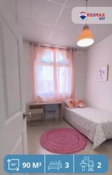 Modern bedroom with accent wall, built-in closet and pattern bedspread Mystic City La Chorrera