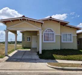 Exterior single story house with columns and front porch at Mystic City La Chorrera Panama