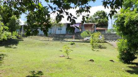 Fenced flat residential lot with mature trees for sale in San Carlos Panama near beach