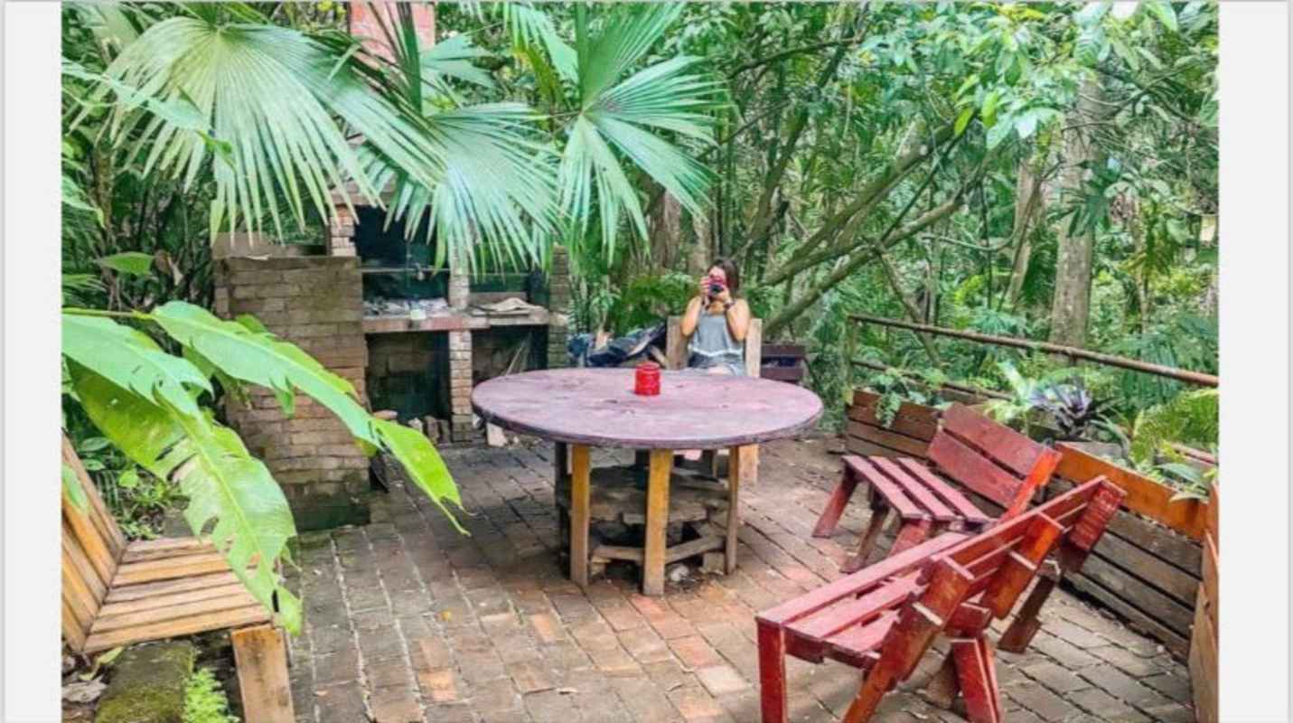 Large multistory green house with balconies surrounded by tropical garden Ancon Hill Panama