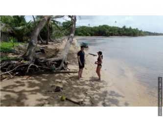 Crystal clear Caribbean sea with snorkeling over coral reef at Bahia Clara Colon Panama